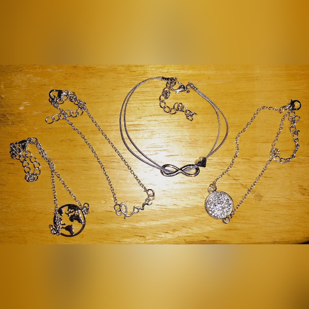 4 Bangle Bracelets Silver in Color